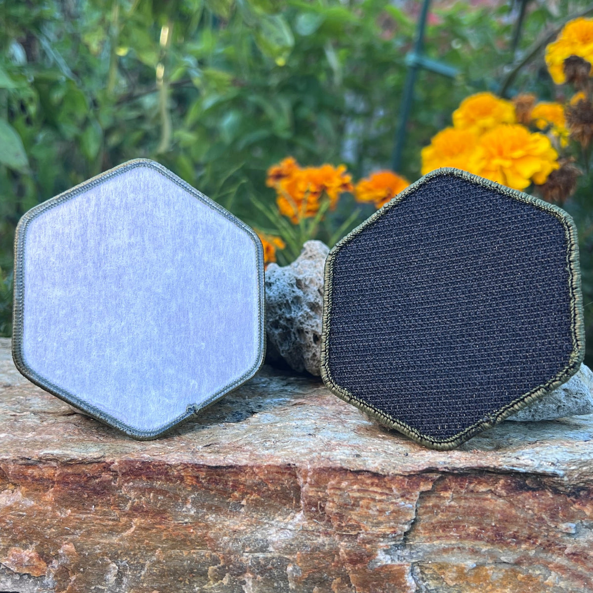 Back of the NOMAD patch: iron-on backing on the left, hook backing on the right